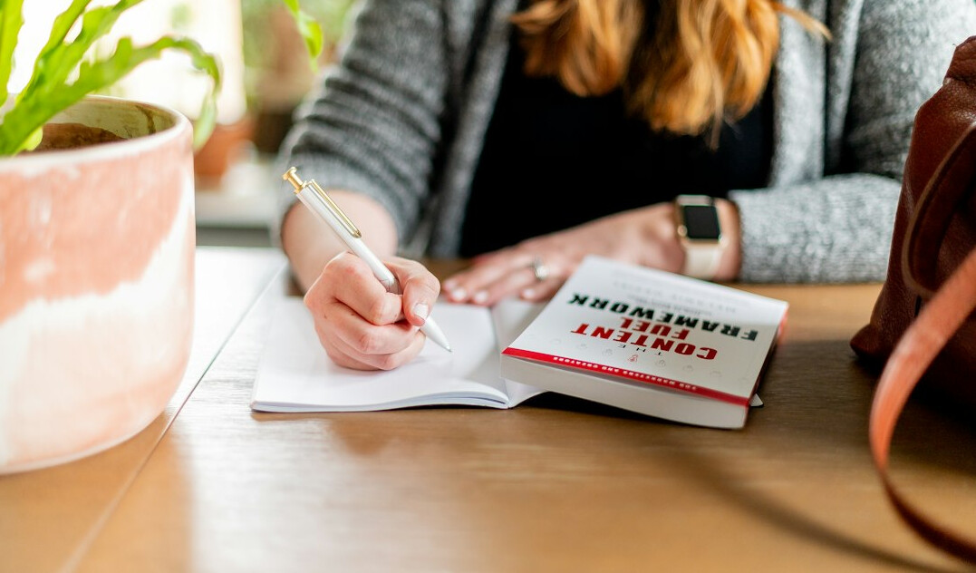 person journaling at desk