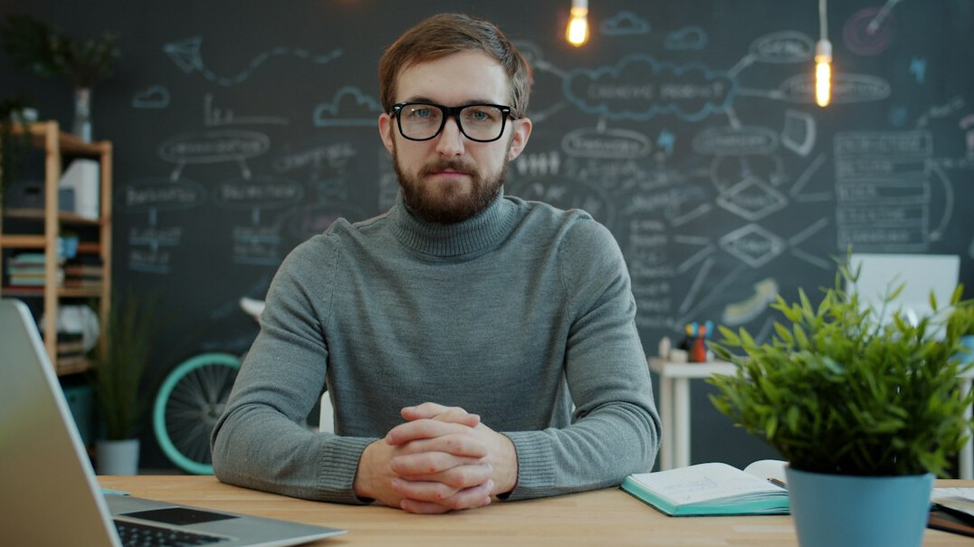professional meditating at desk